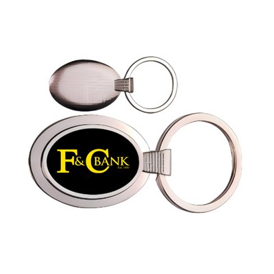 Oval metal key chain with dark reflective center